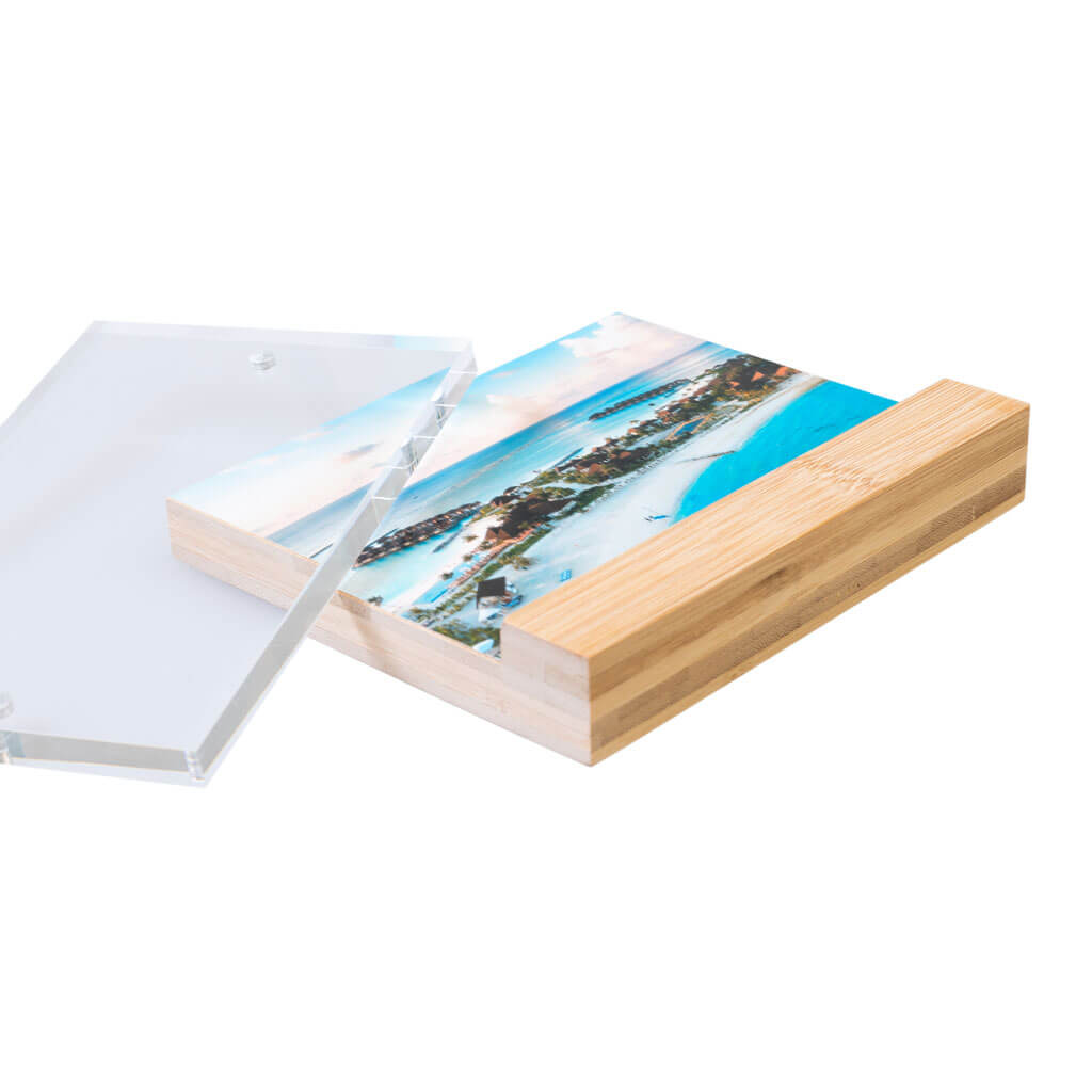 Wooden photo frame with a scenic print on a white background