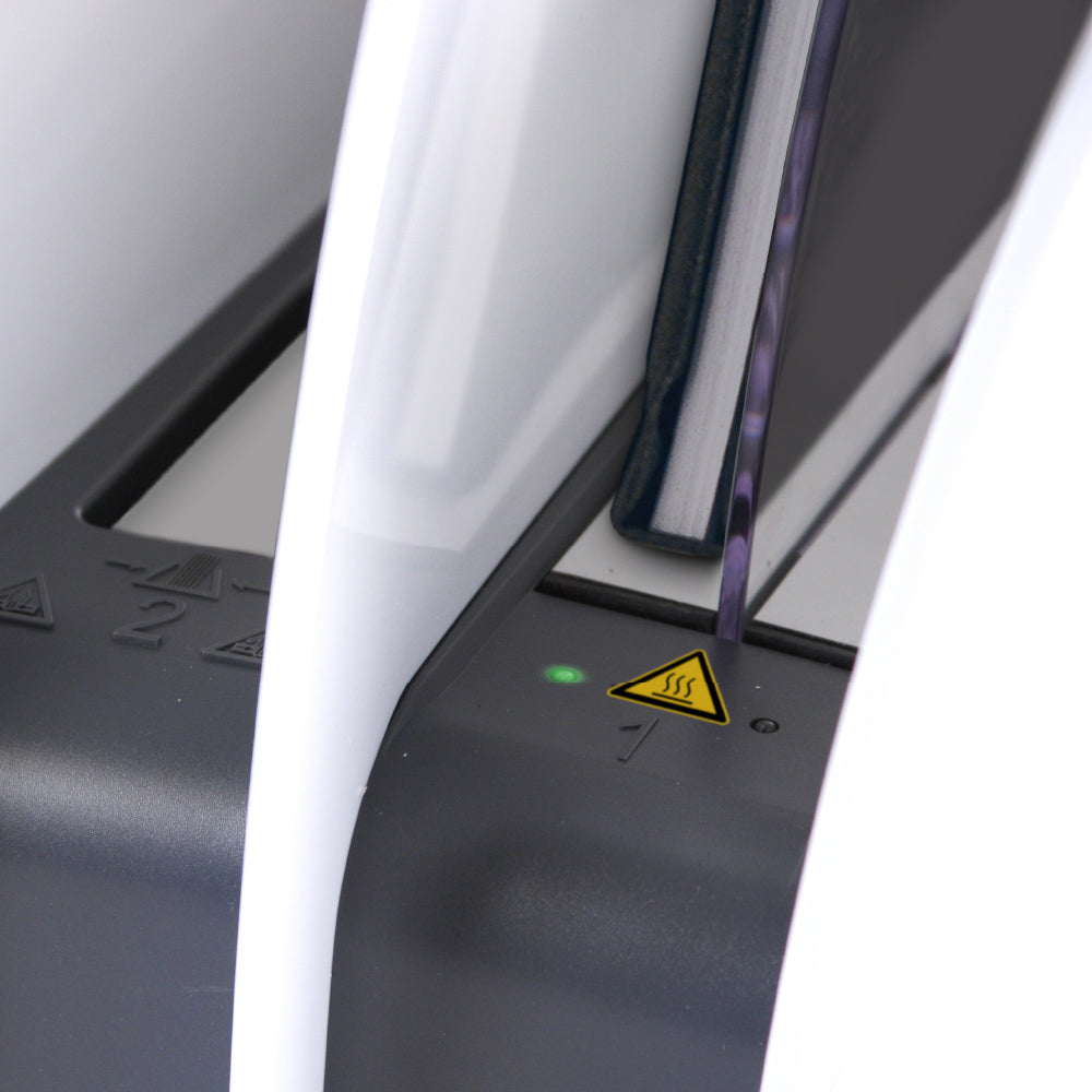 Close-up of a white 8.4 thermal binding device