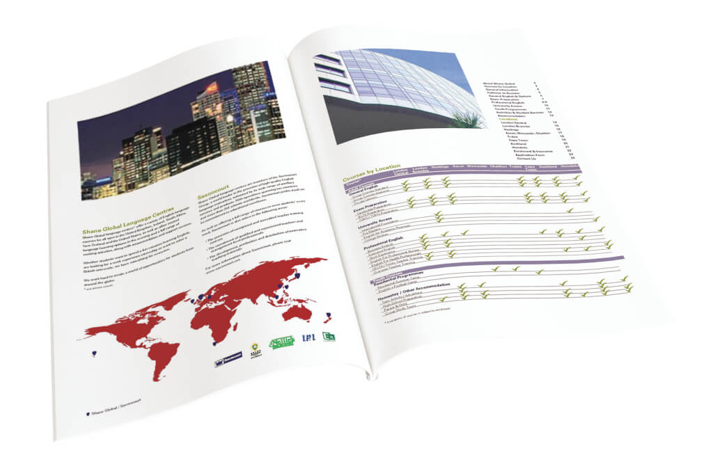 Open brochure with world map, cityscape, and architectural images on a white background