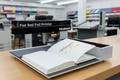 Flat Bed Foil Printer with open book and gold foil text