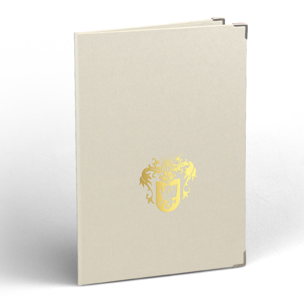 Beige notebook with a gold emblem on a white background