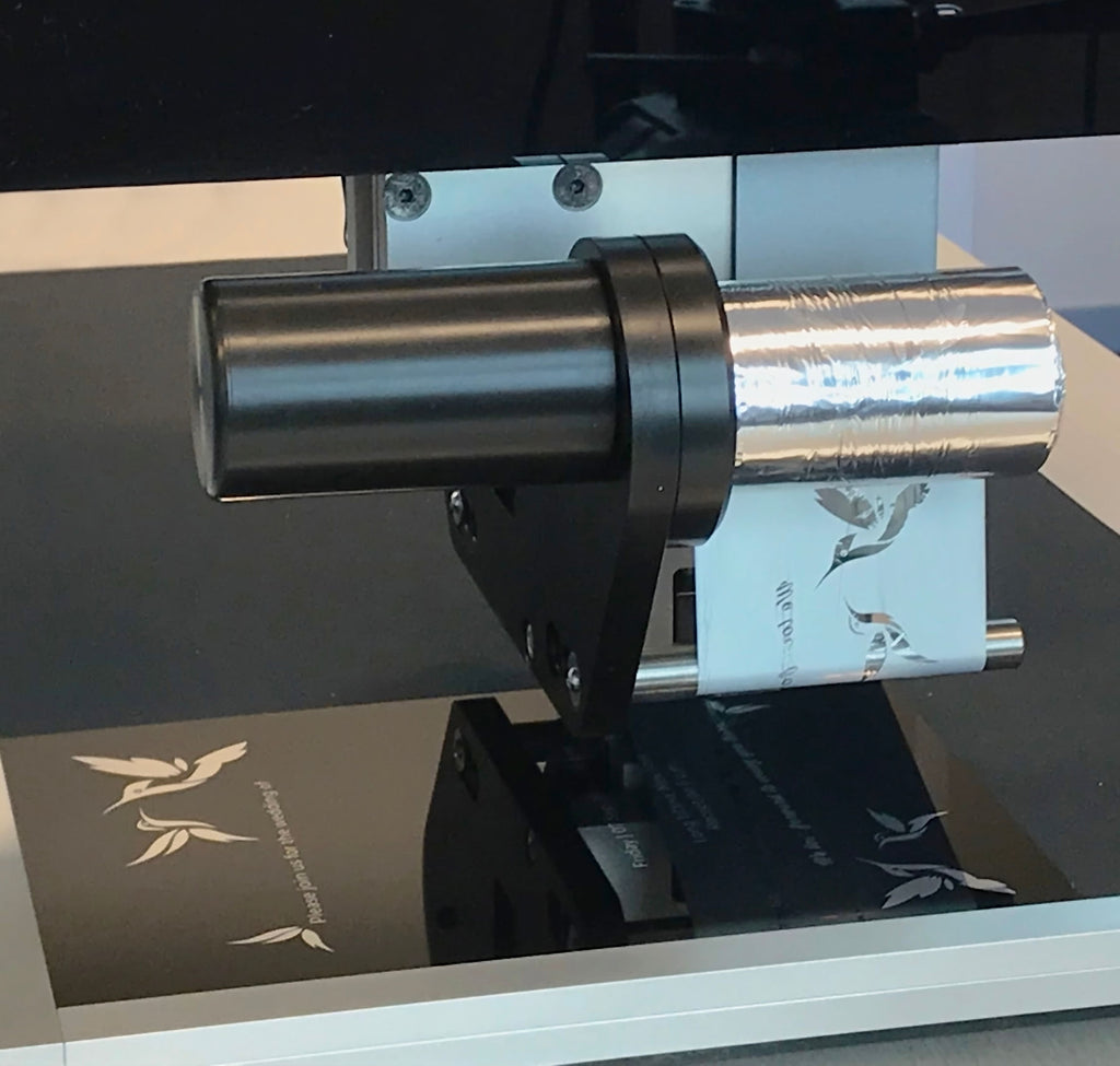 Metallic silver foil printing  on to a reflective surface