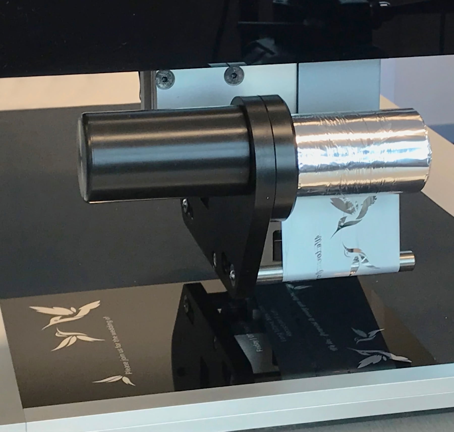 Metallic silver foil printing  on to a reflective surface